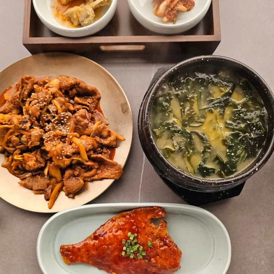 Two set meals laid out on a spacious table