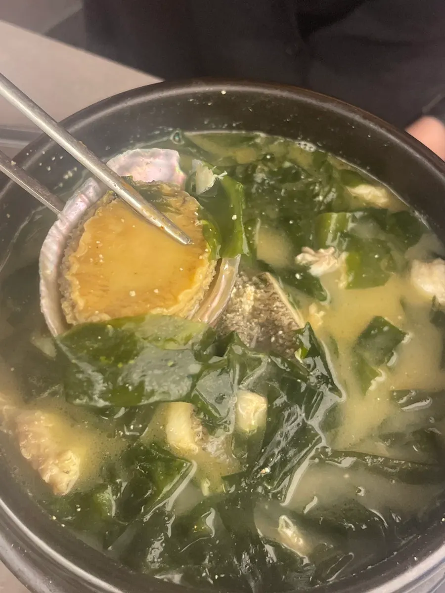 Close-up of the rich broth in the beef seaweed soup