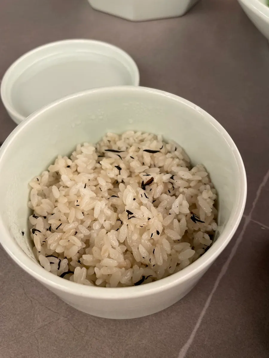 A bowl of seaweed soup with flounder flesh lifted out