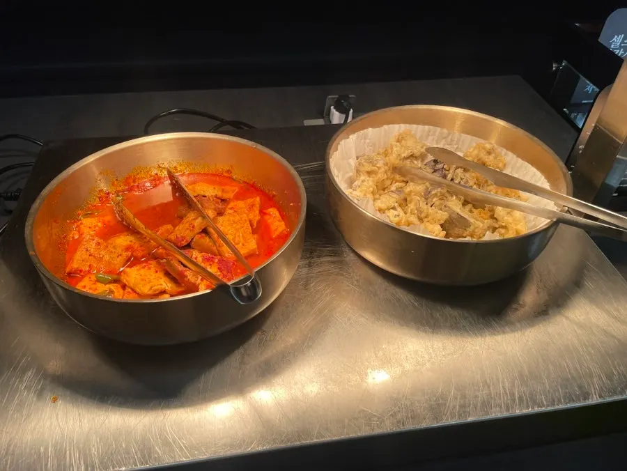 Neatly arranged side dishes at the self-serve bar