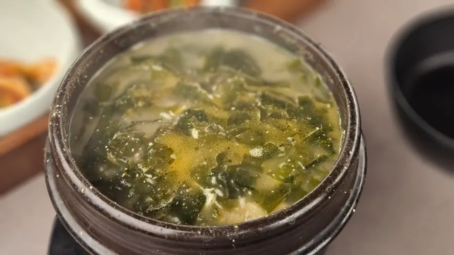 Stone bowl of milky flounder seaweed soup