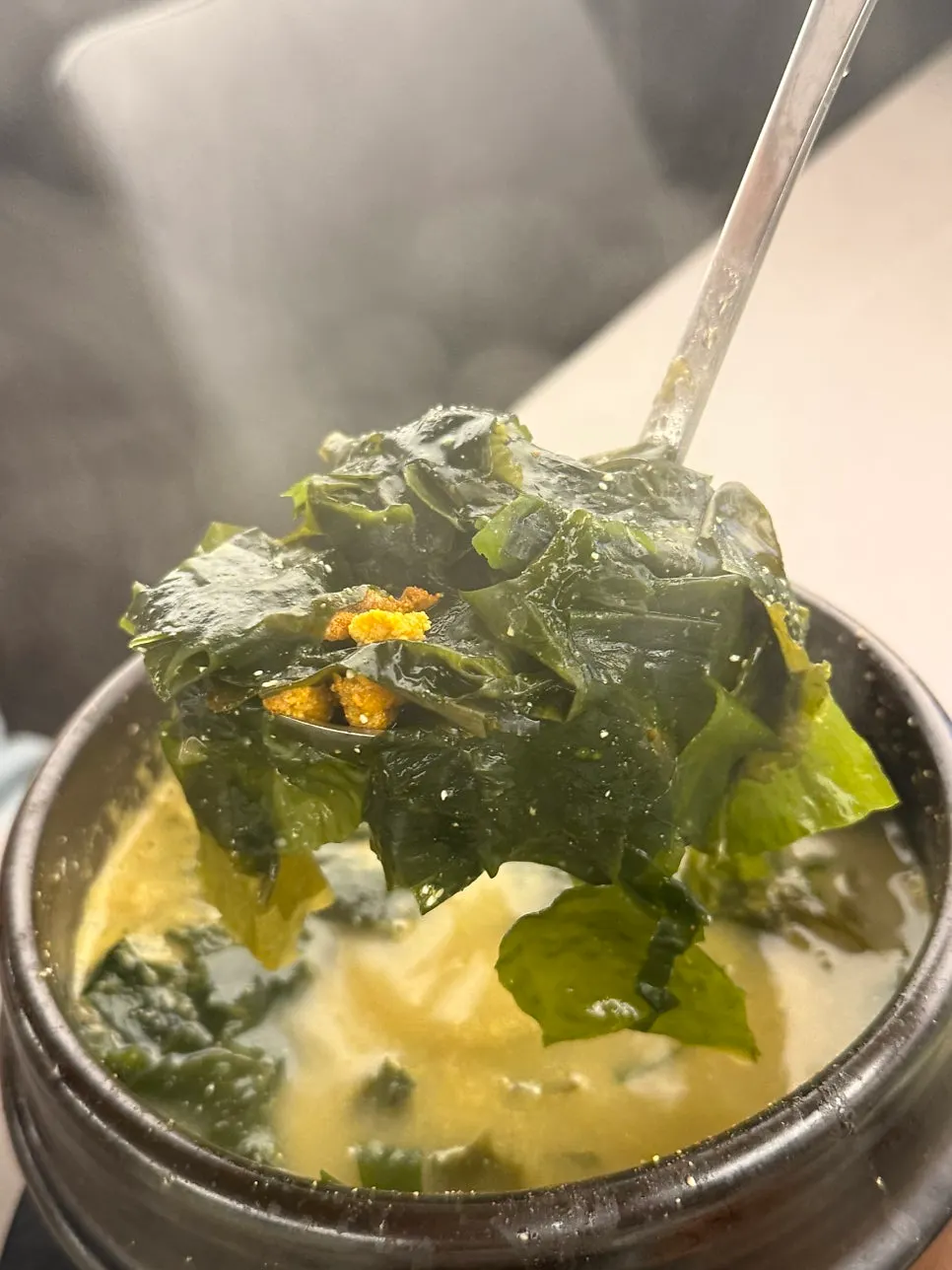 Broth of seaweed soup with sea urchin roe