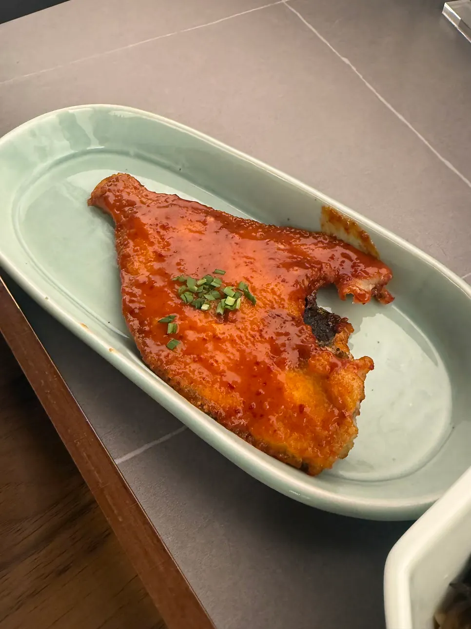 A plate of spicy seasoned grilled flounder