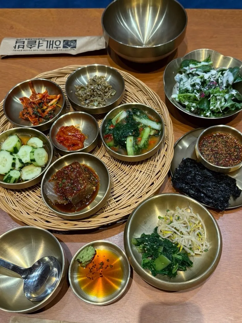 Table set with Haenyeo Sotbap's 13-dish banchan spread