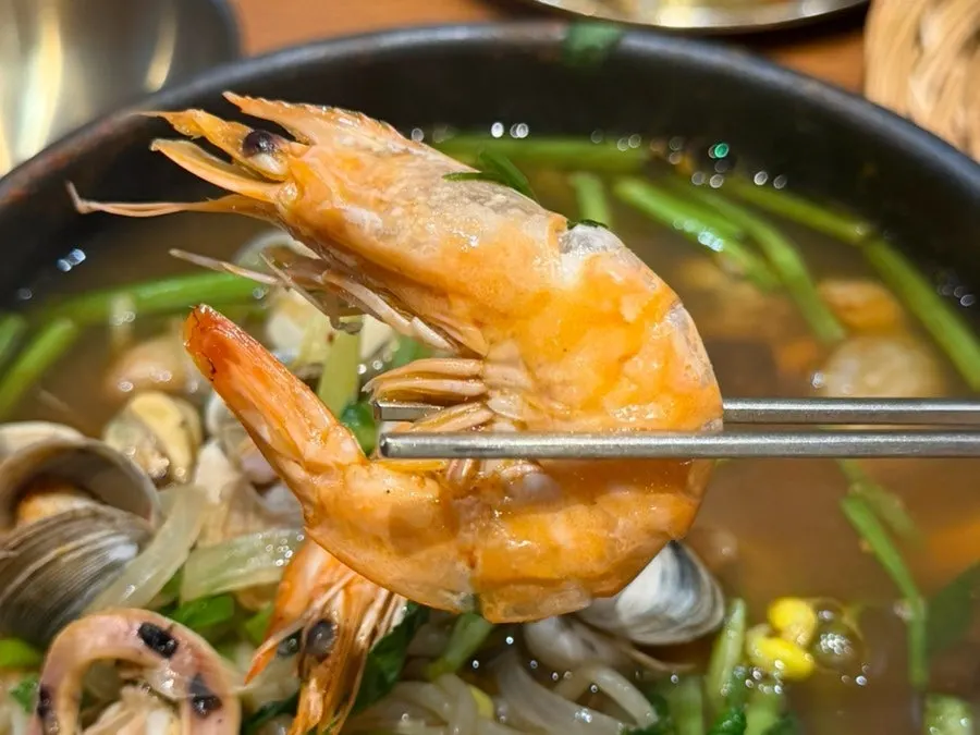Seafood stew loaded with bean sprouts and water dropwort