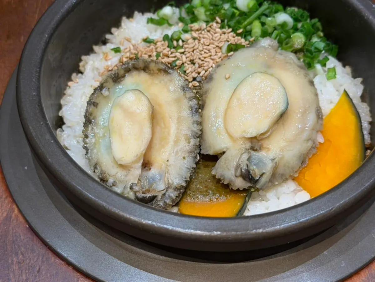 Wando abalone sotbap topped with two abalones
