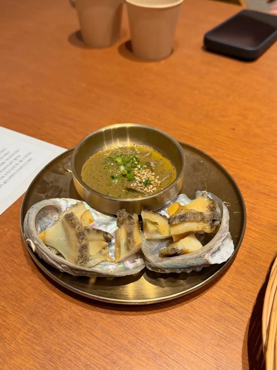 Plate of Haenyeo Sotbap grilled abalone with butter