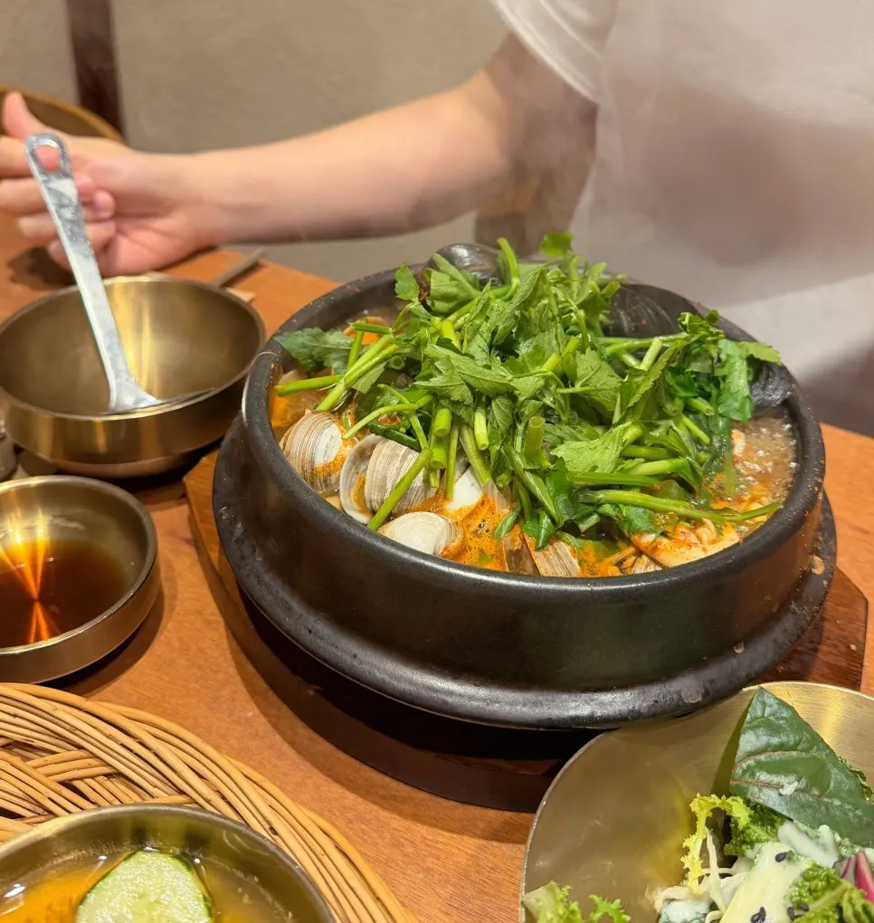 Abalone seafood-packed stew topped with water dropwort