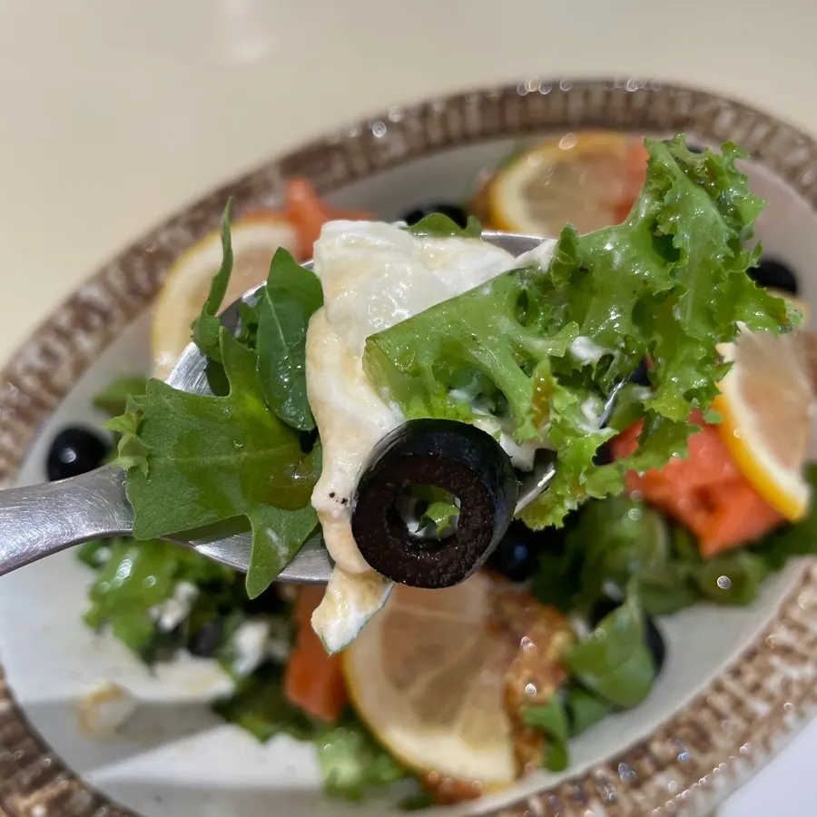 Eating a bite-sized piece of salmon