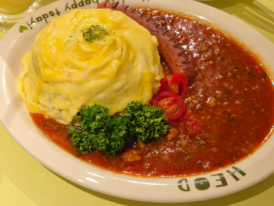 HEOD omurice served with sauce and sausage