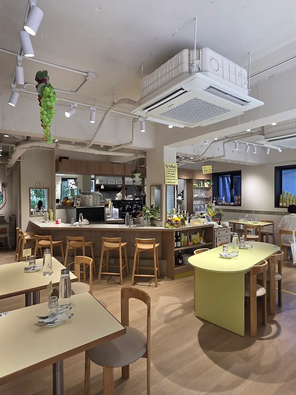 Interior of HEOD Mapo with beige and lime-green accents