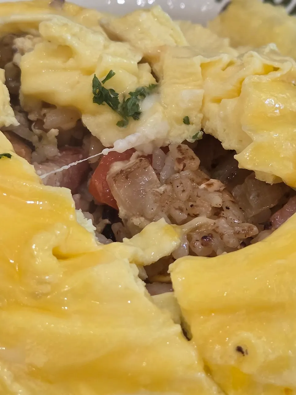 HEOD omurice served with sausage and tomato