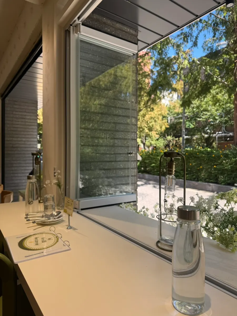 Open window seating with forest trail view at HEOD Mapo