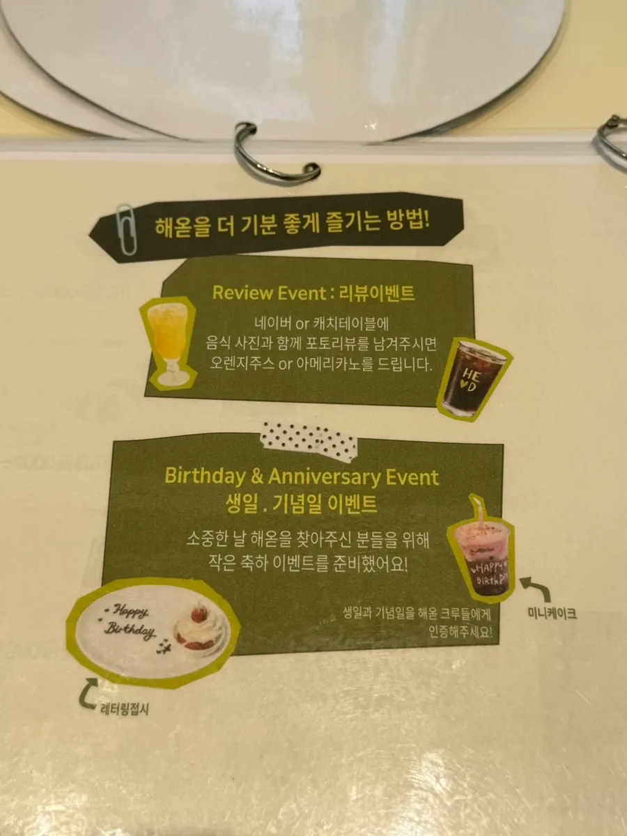 Sign explaining birthday, anniversary, and photo review perks