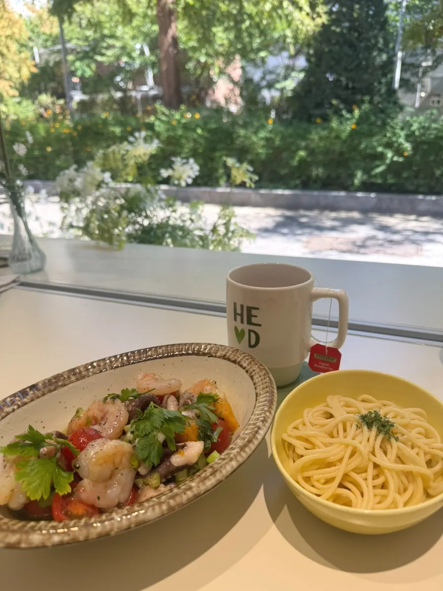 Seafood salad topped with mango and cherry tomatoes