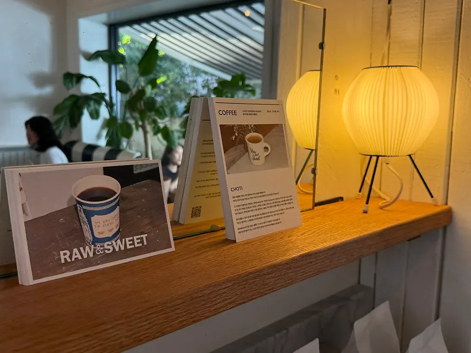 Café interior decorated in wood tones and white tile