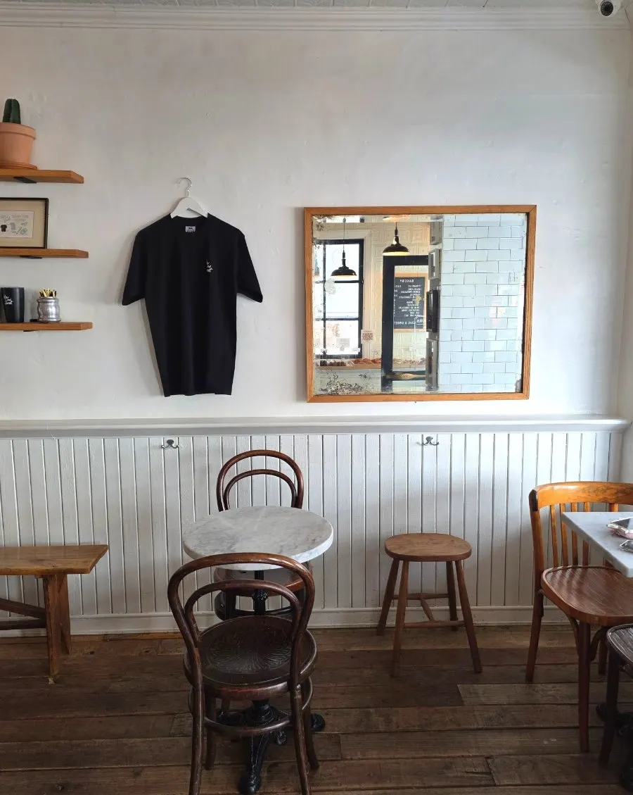 Corner of the café decorated with posters and props