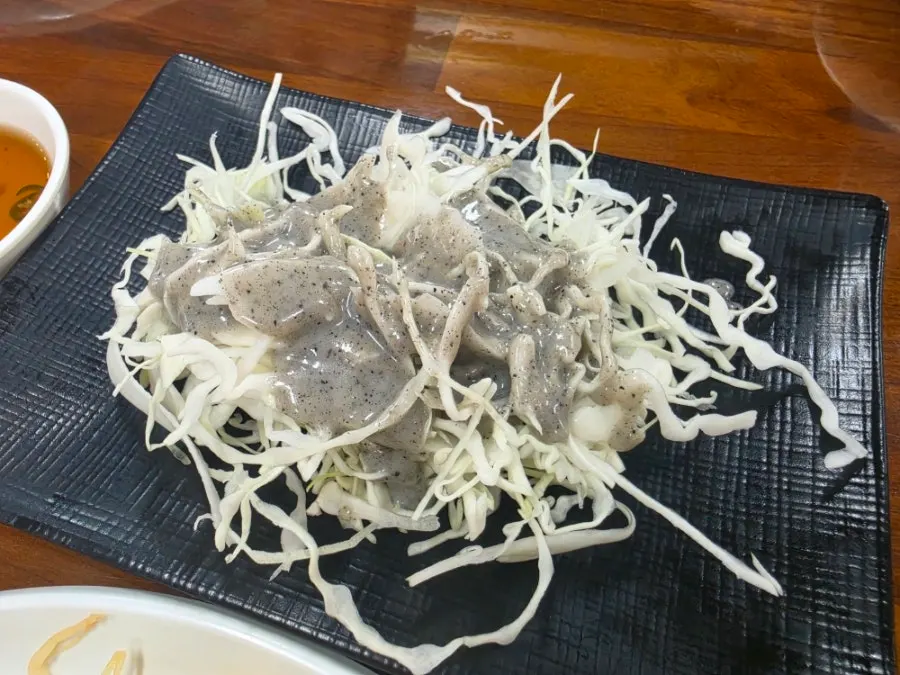 Filling a plate with side dishes at the self-serve corner