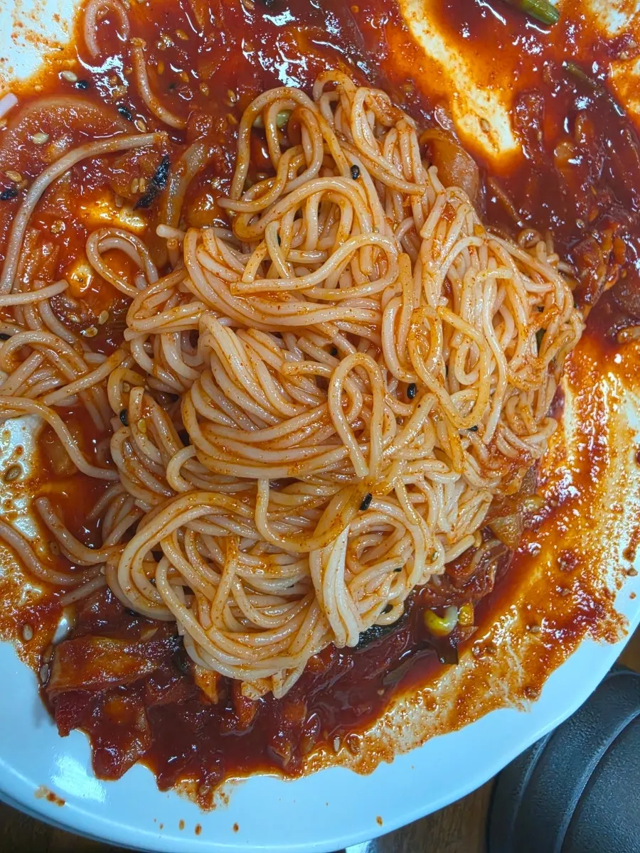 Chopsticks lifting sauce-mixed somyeon noodles