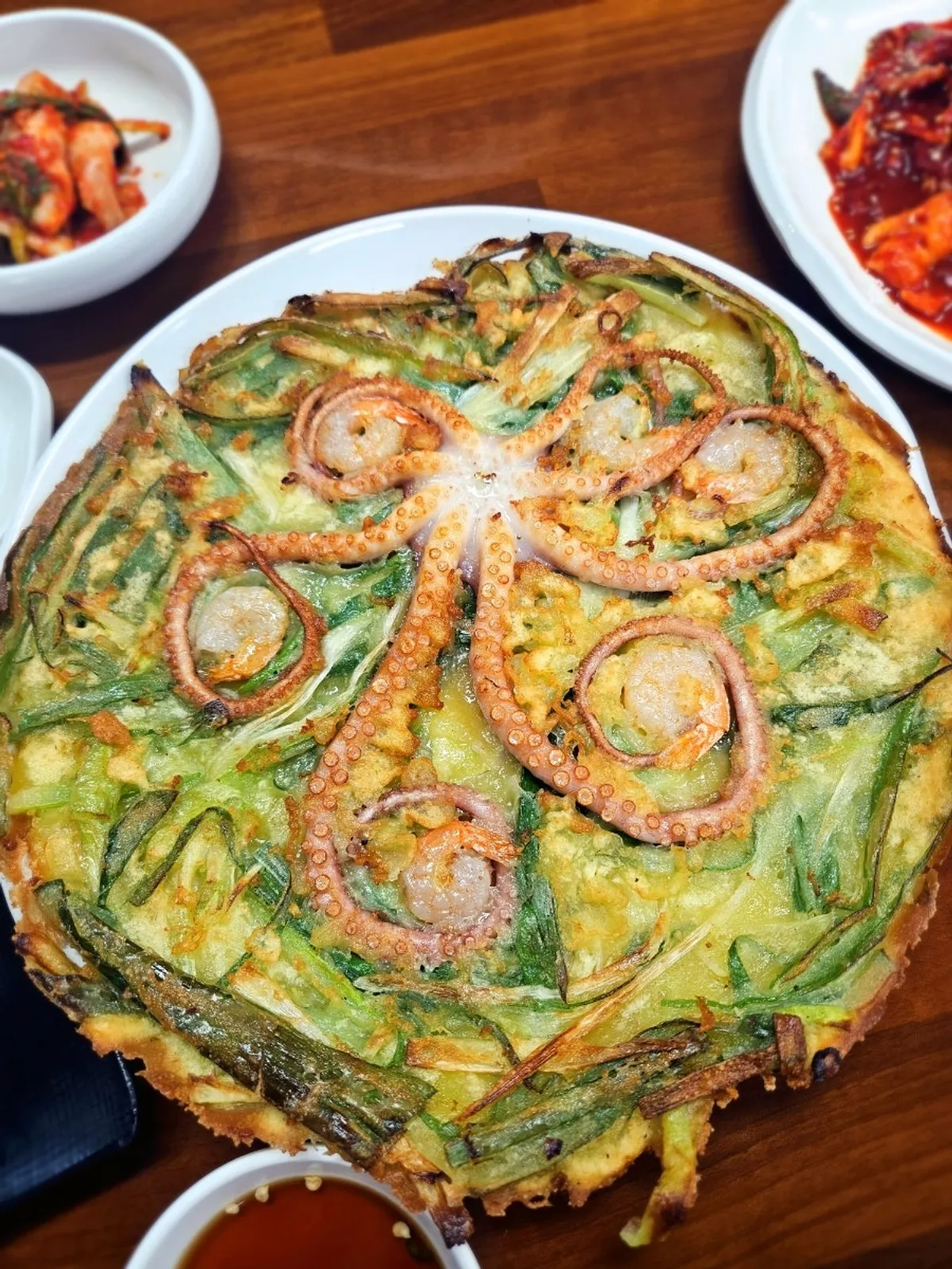 Whole octopus laid over Haesanggung's octopus pancake
