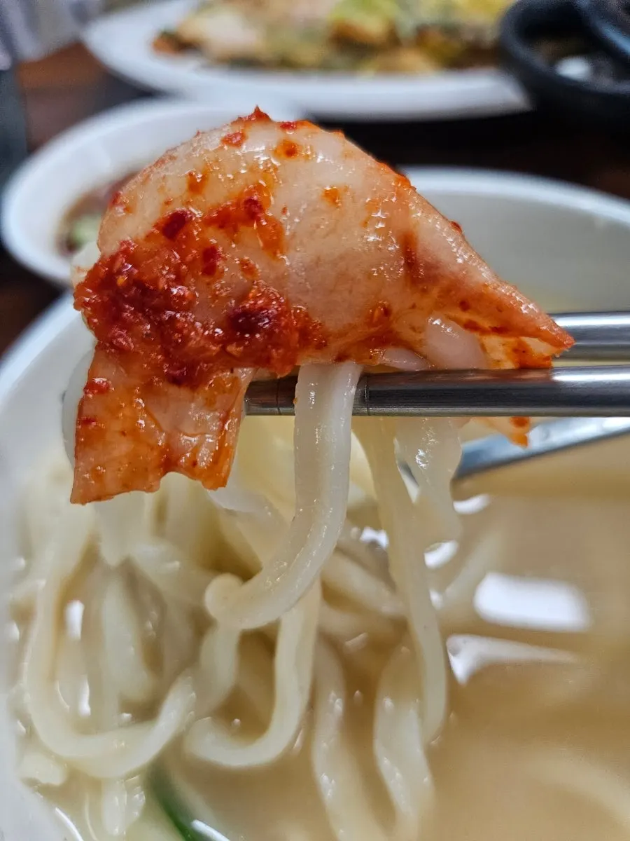 Chewy kalguksu noodles served with kimchi