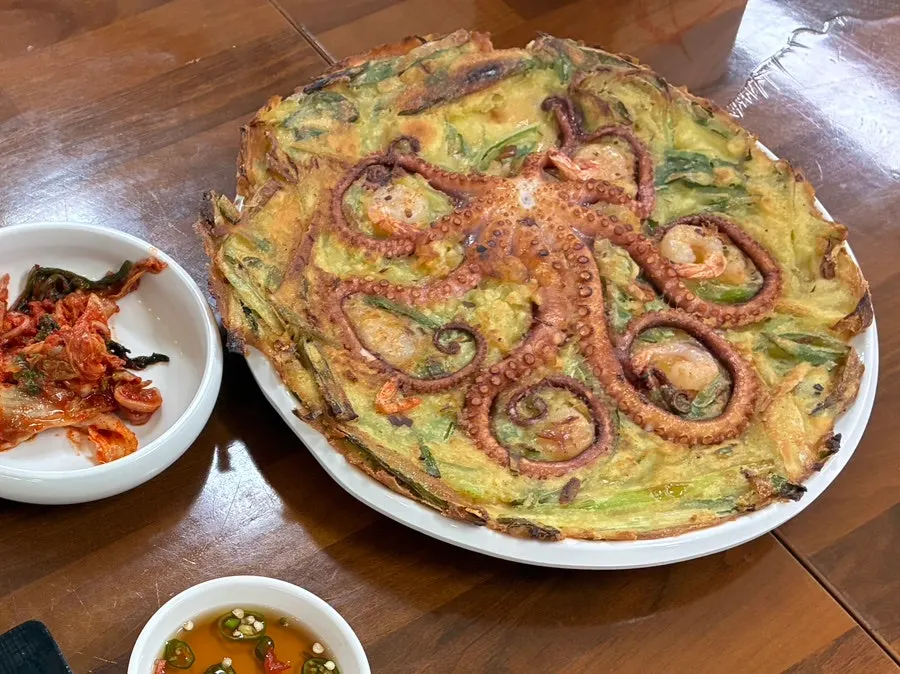 Close-up of the crispy fried whole octopus pancake