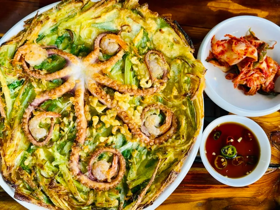 Cross-section of the whole octopus pancake with golden crispy edges