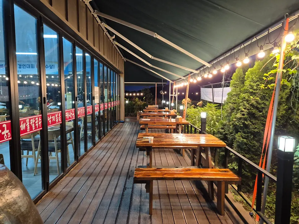 Haesanggung's outdoor terrace seating beyond the floor-to-ceiling windows