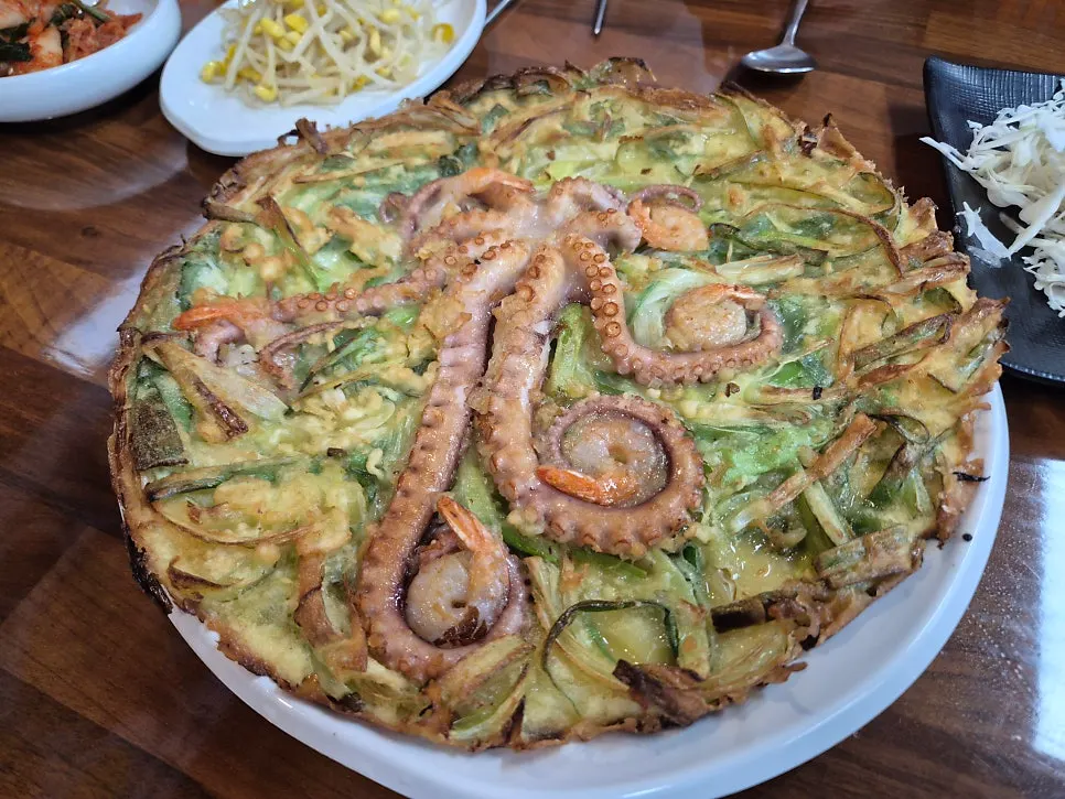 Whole octopus pancake with the octopus sitting on top