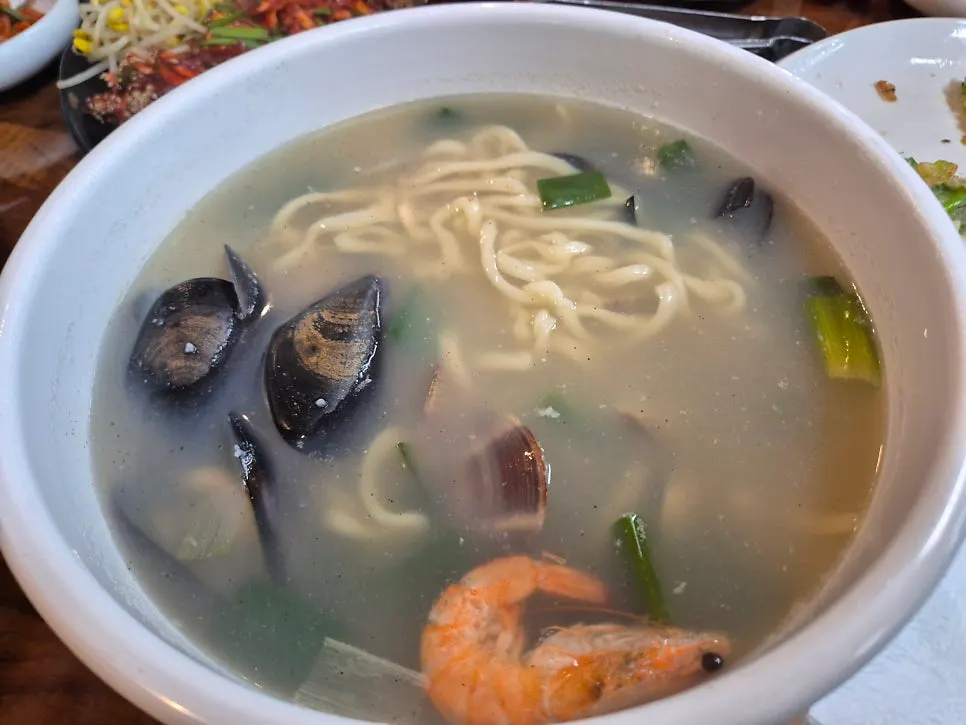 Seafood kalguksu with shrimp, mussels, and clams