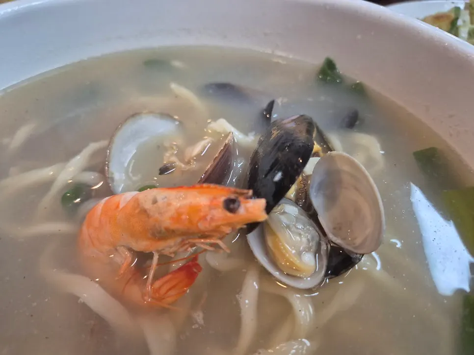 Kalguksu noodles lifted up with chopsticks