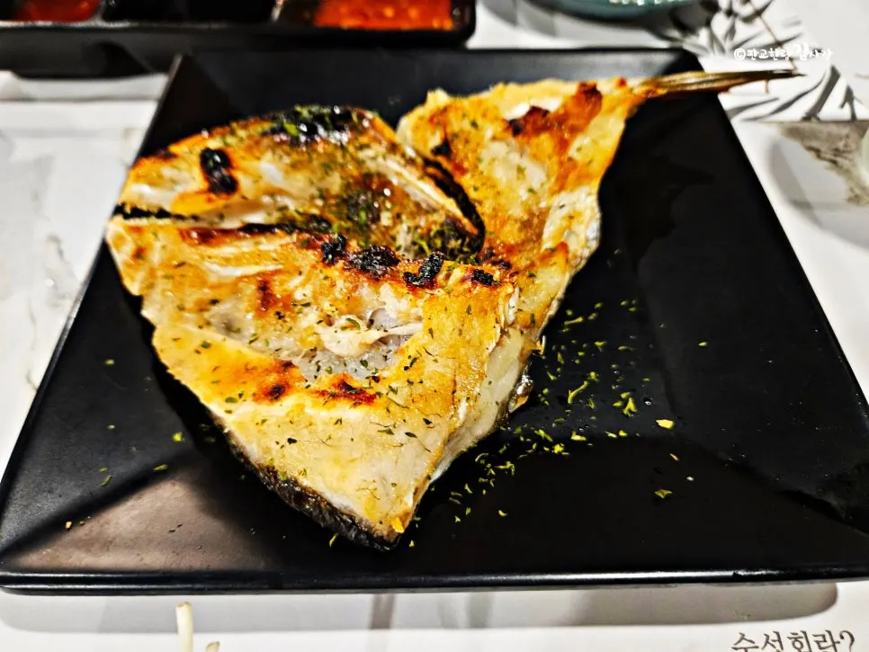 A thickly sliced piece of rockfish aged sashimi