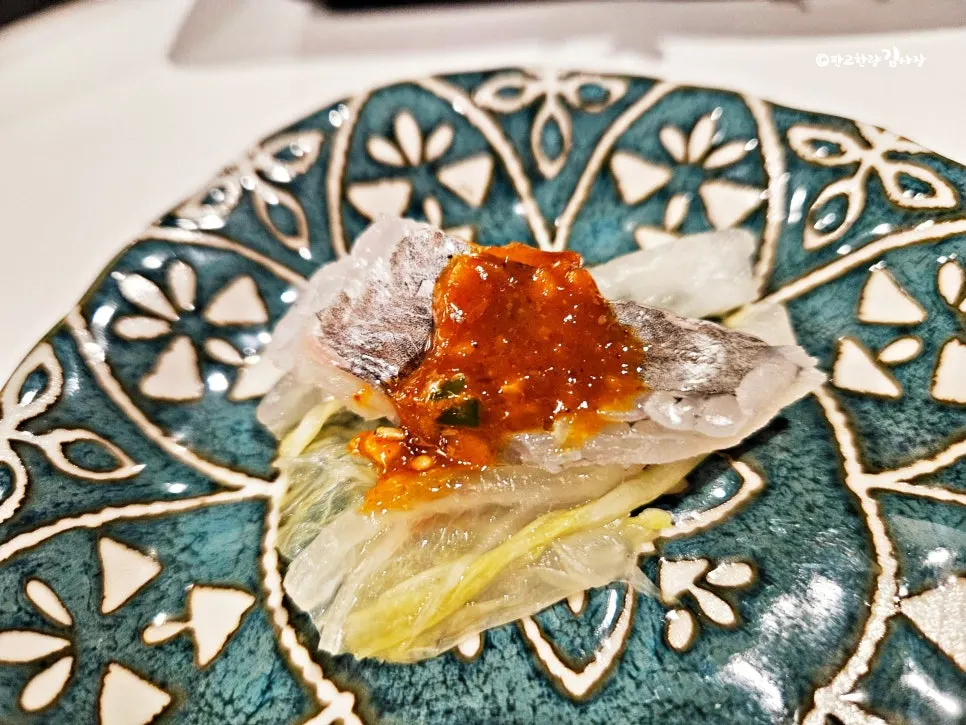 A piece of aged sashimi with side dishes