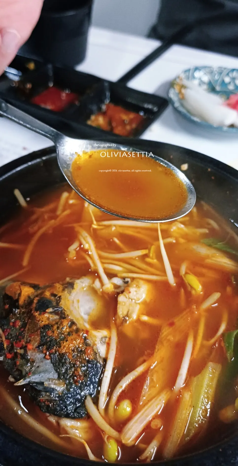 Spicy stew with a whole rockfish head