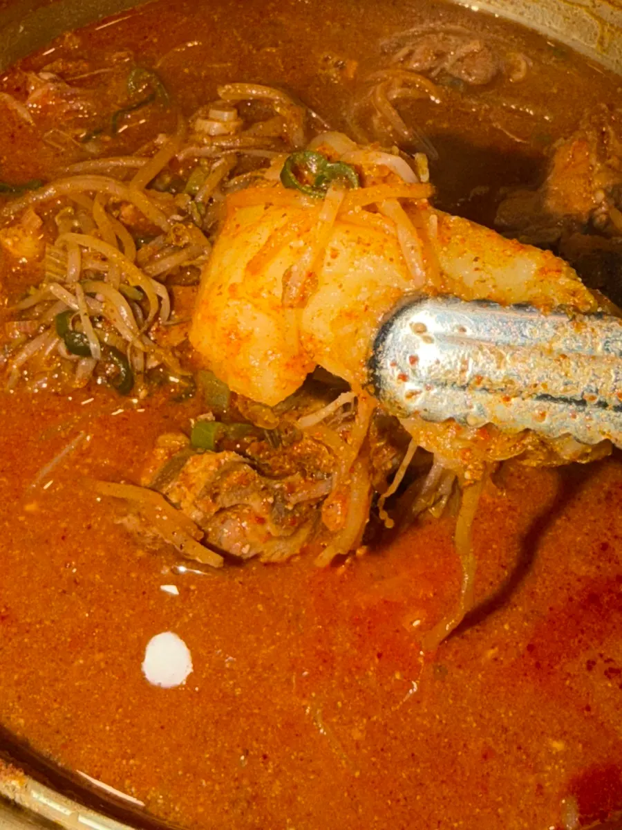 Tender gamjatang bone meat easily pulling apart