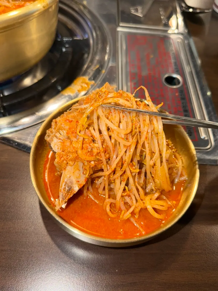 Close-up of gamjatang broth with potatoes