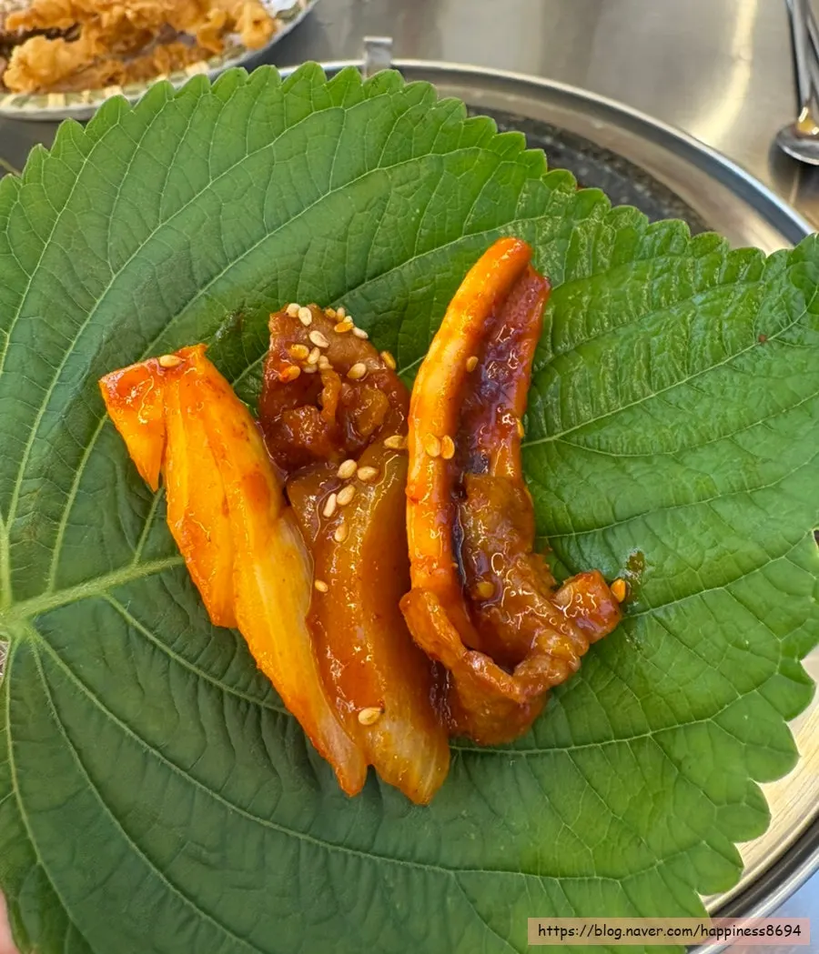 Table with sample bossam and fried squid together