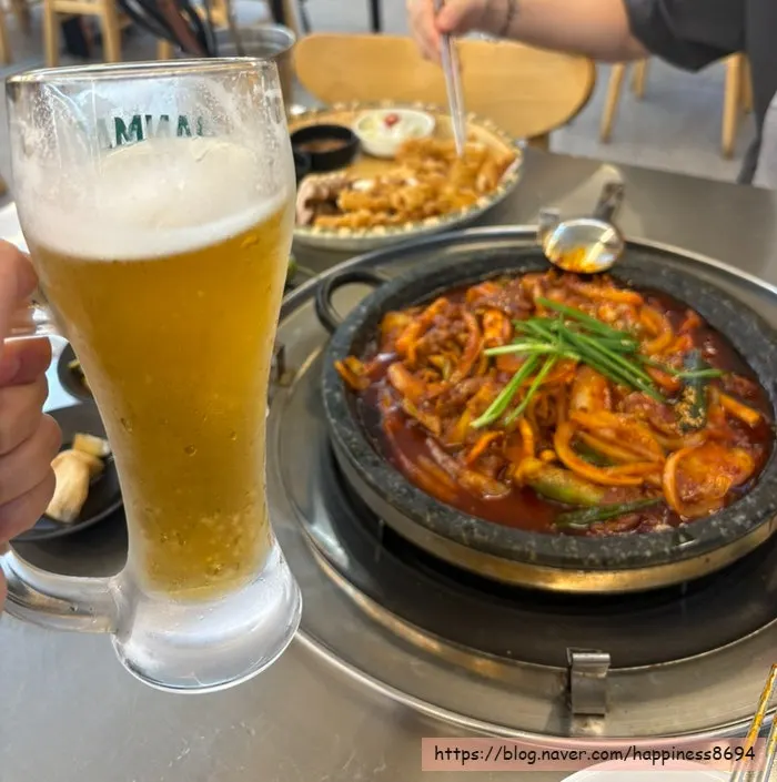 A glass of draft beer enjoyed with fried squid