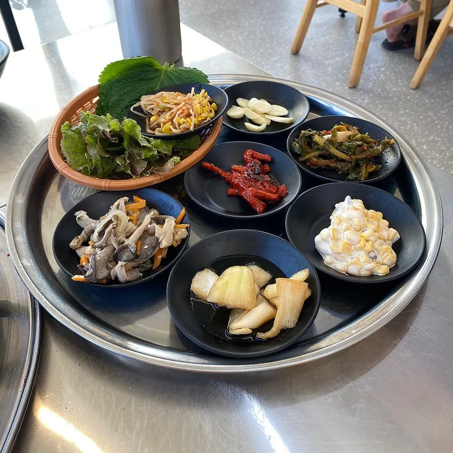 A spread of small side dishes portioned out
