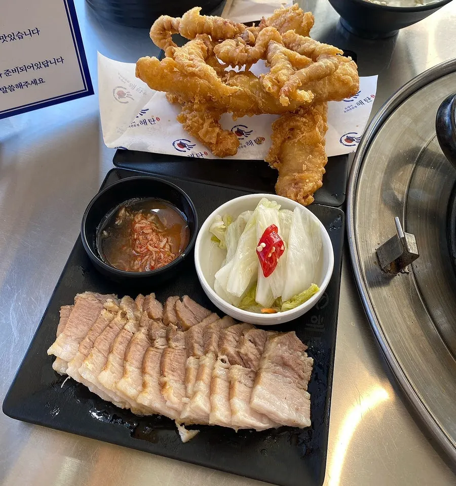 One-person pork belly bossam served alongside the hot-plate squid