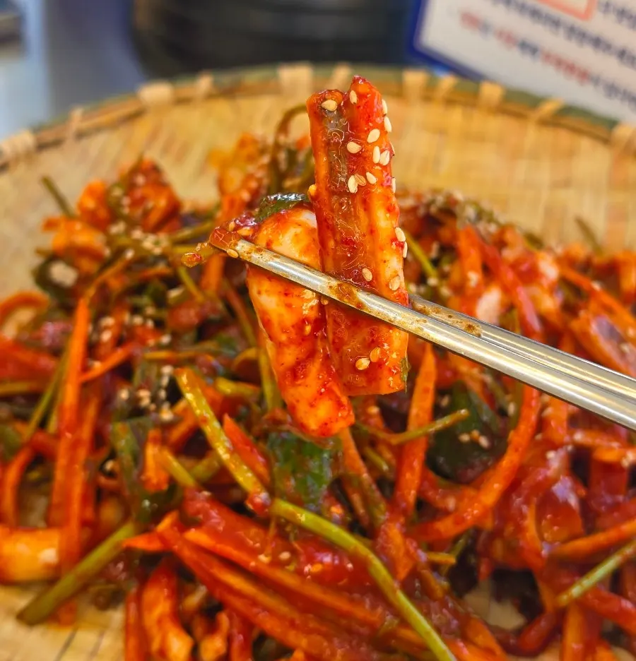 Squid vinegar salad piled generously on a wide plate