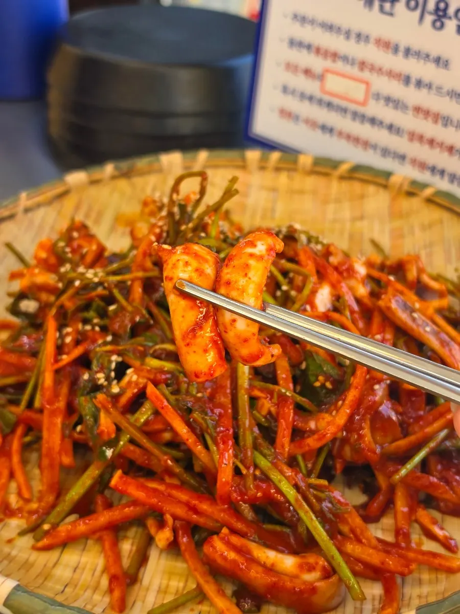 Close-up of squid vinegar salad mixed with minari and vegetables