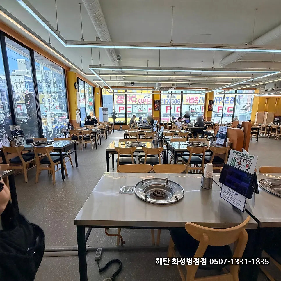 Spacious dining room with tables along the windows