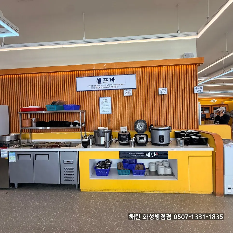 Self-serve bar with water, small plates, and tableware