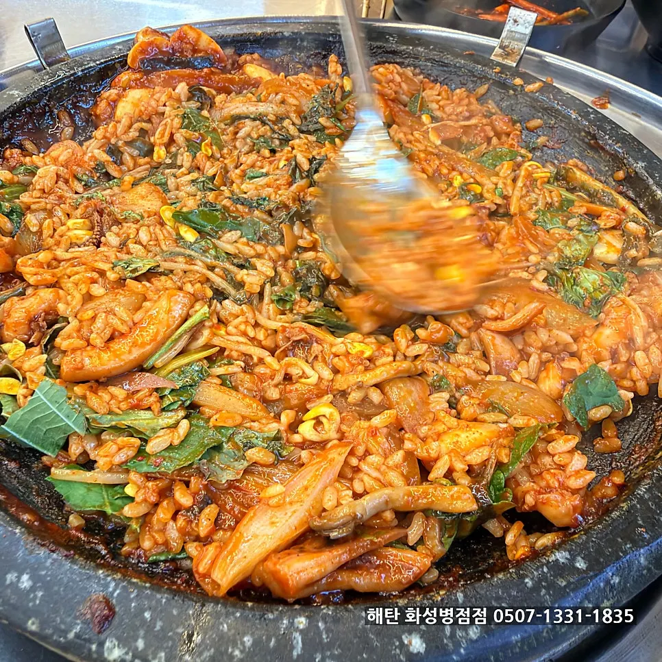 Finished hot-plate fried rice with squid and rice cake mixed in