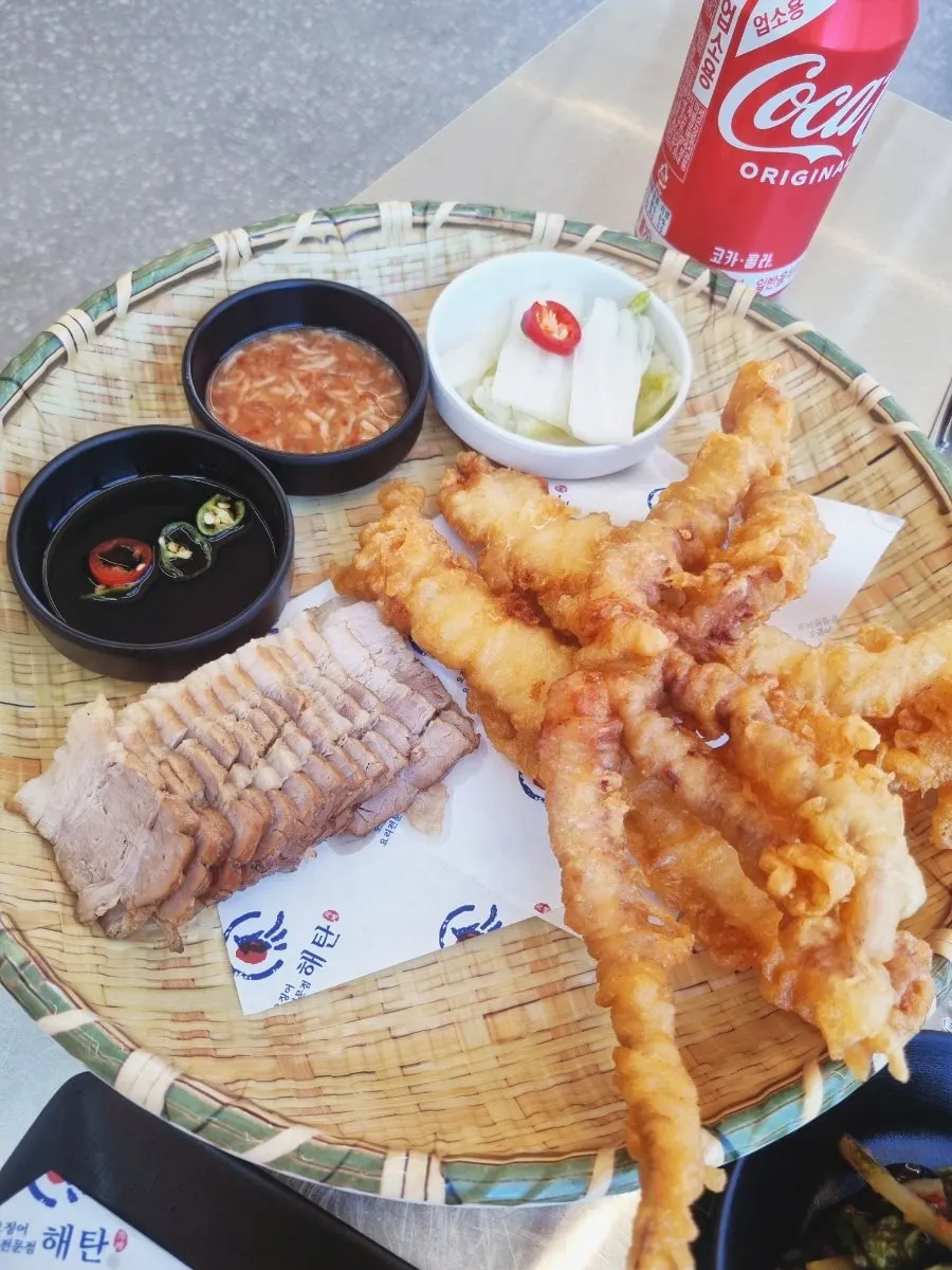 Basket of bossam and squid fritters served together