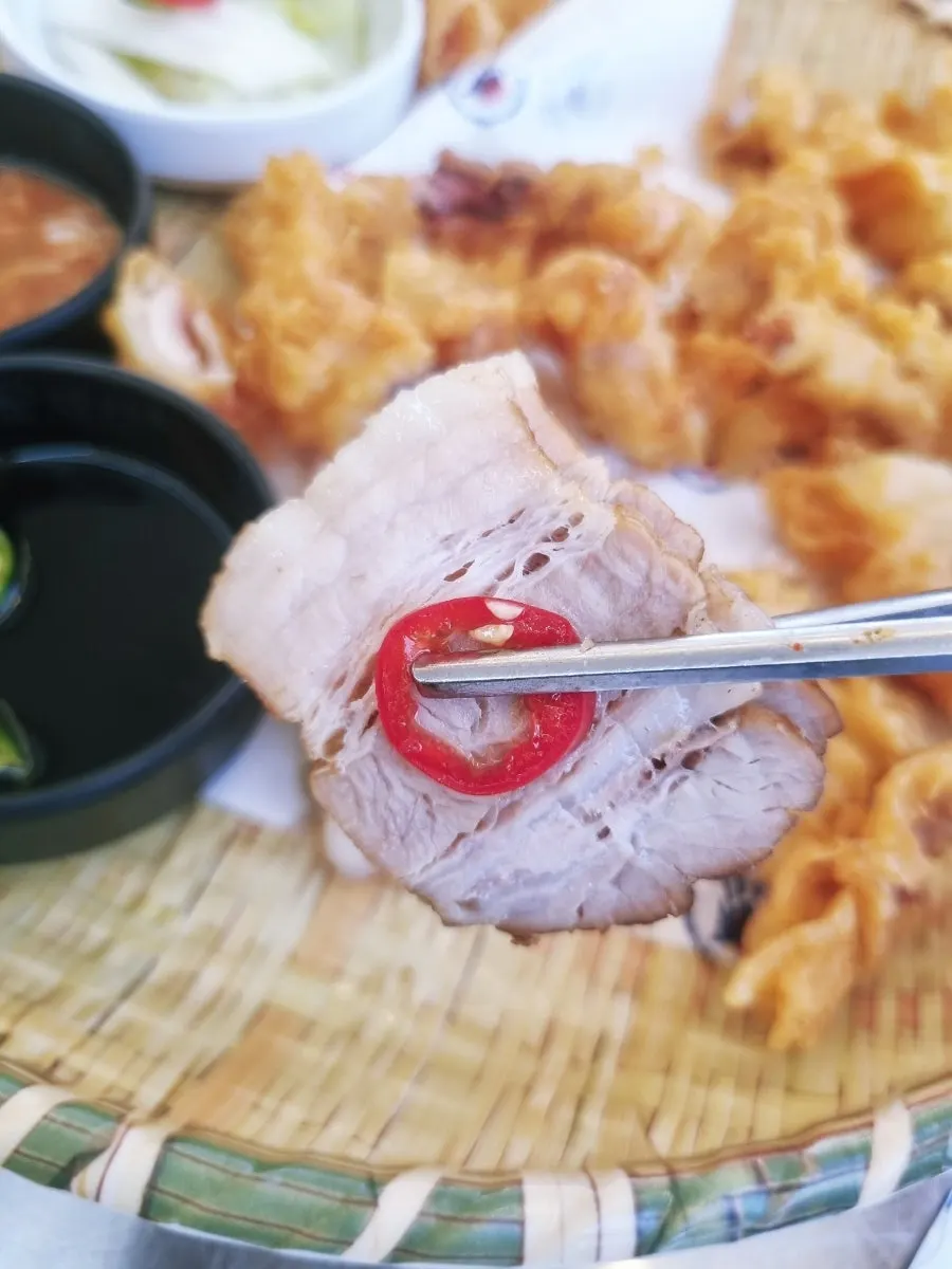 Pork belly bossam dipped in salted shrimp