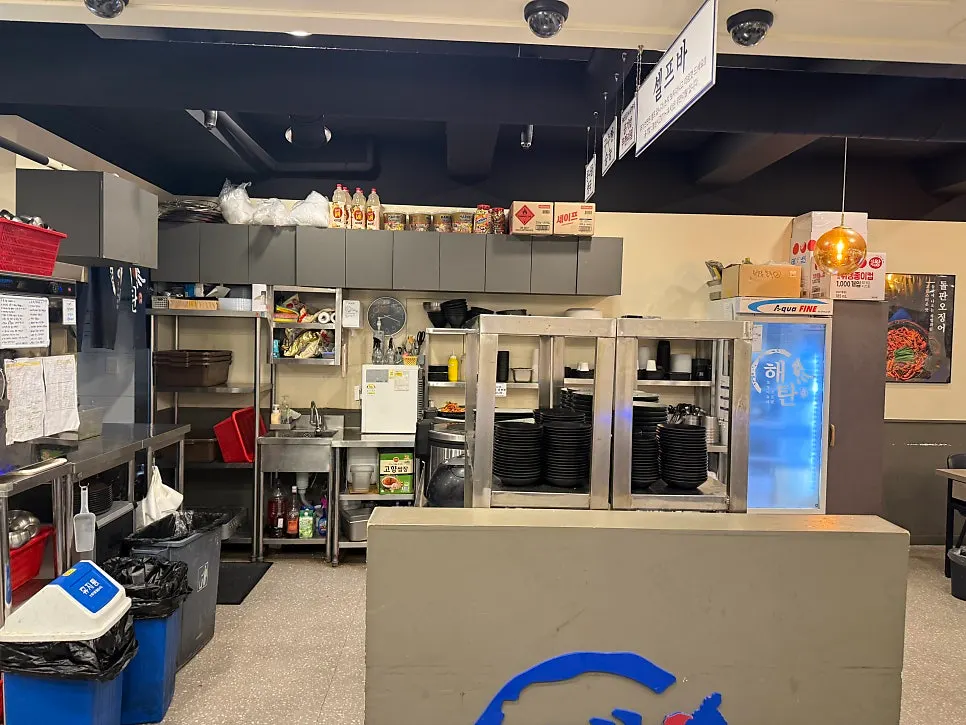 Restaurant interior with seating on both sides of the self-serve bar