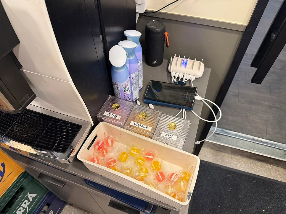 Charging station with hair ties, toothpicks, and dental floss at the entrance