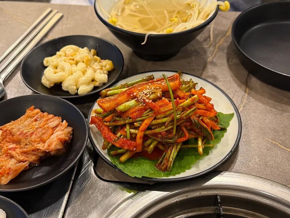 Spicy squid salad with minari tossed in a sweet-and-tangy sauce